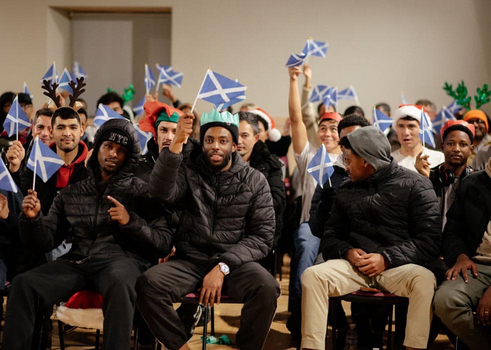 New Scots gathering and celebrating together in Scotland